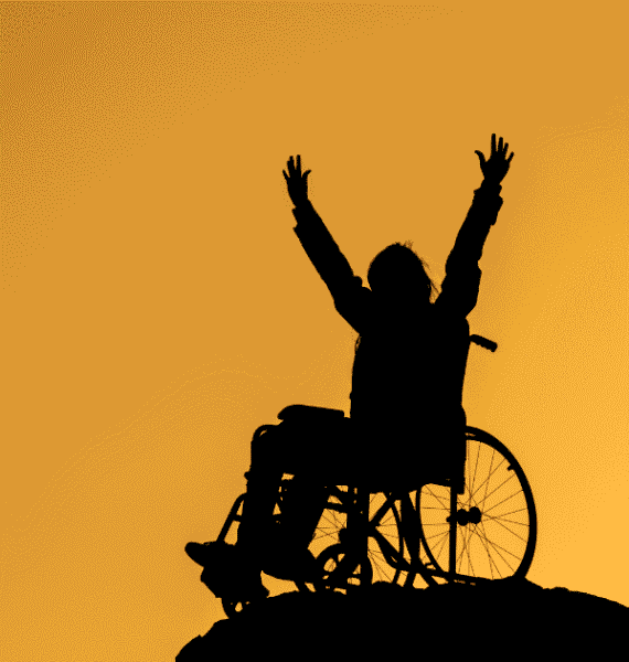 person in a wheelchair on top of a hill